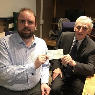 Mike Wood Chairman receiving a cheque donation