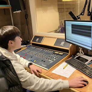 Picture of one of our Volunteers at the mixing desk